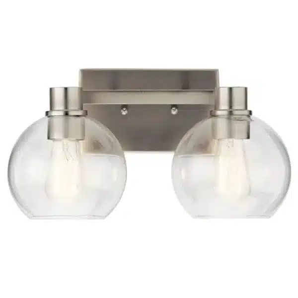 Le luminaire de salle de bain Harmony de 15,5 po à 2 lumières présente un style transitionnel intemporel caractérisé par des lignes épurées, des abat-jours en verre clair et un élégant fini nickel brossé. Grâce à son design sobre et polyvalent, Harmony s’intègre parfaitement à une variété de décors, qu’ils soient transitionnels, classiques ou traditionnels. Idéal au-dessus d’un lavabo ou d’un meuble-lavabo, il procure un éclairage fonctionnel tout en ajoutant une touche de raffinement à la pièce.